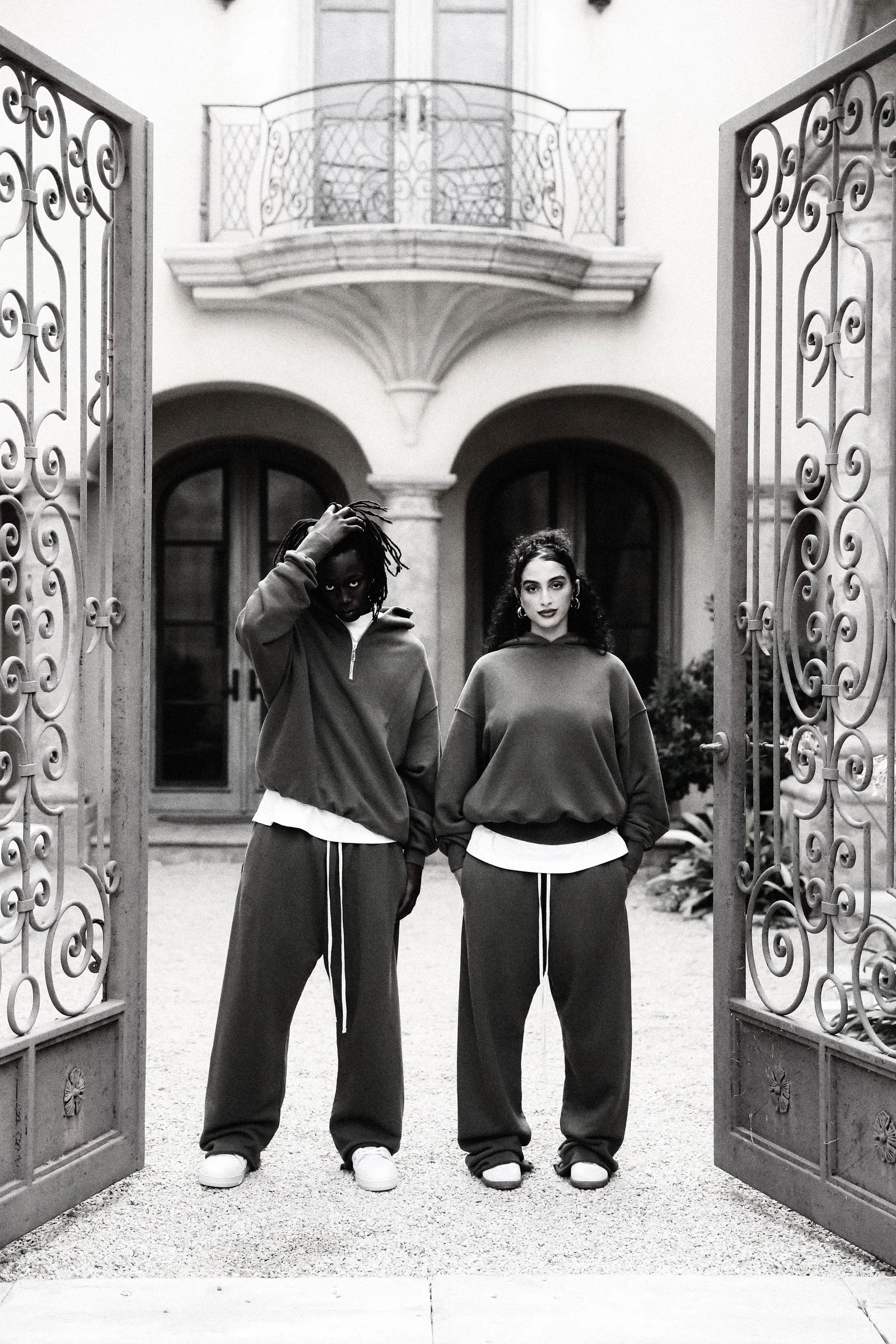 Black-and-white Cannon Mitchel gate portrait with two models.
