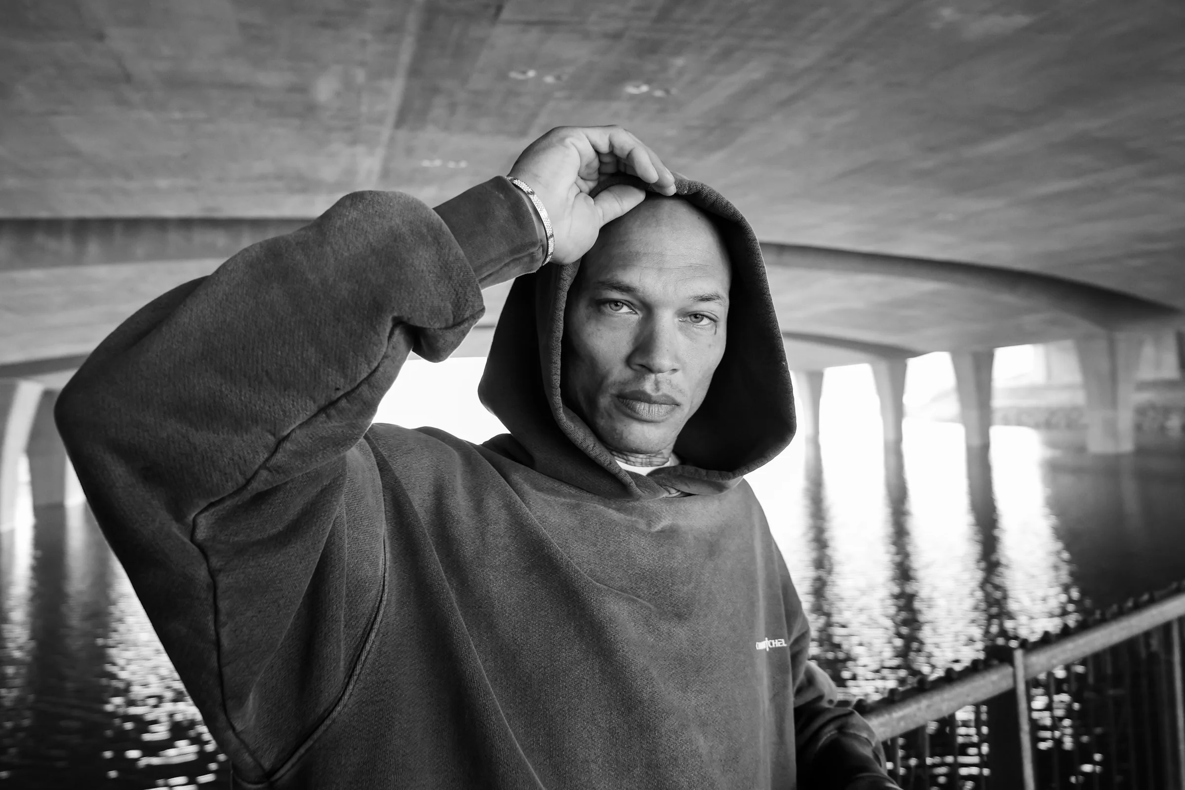 Wide parking structure portrait with Cannon Mitchel hoodie styling.