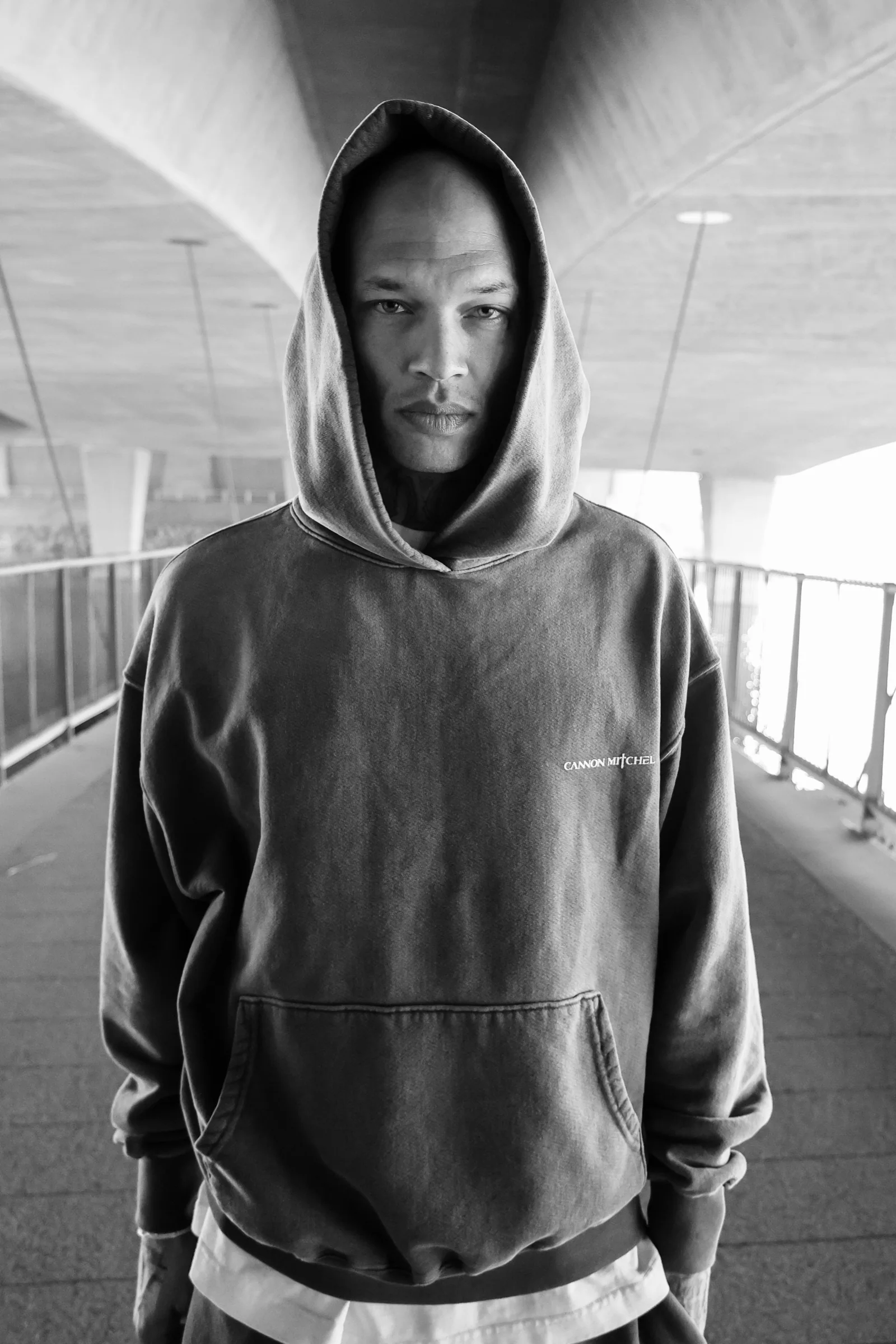 Vertical parking structure portrait with Cannon Mitchel hoodie styling.