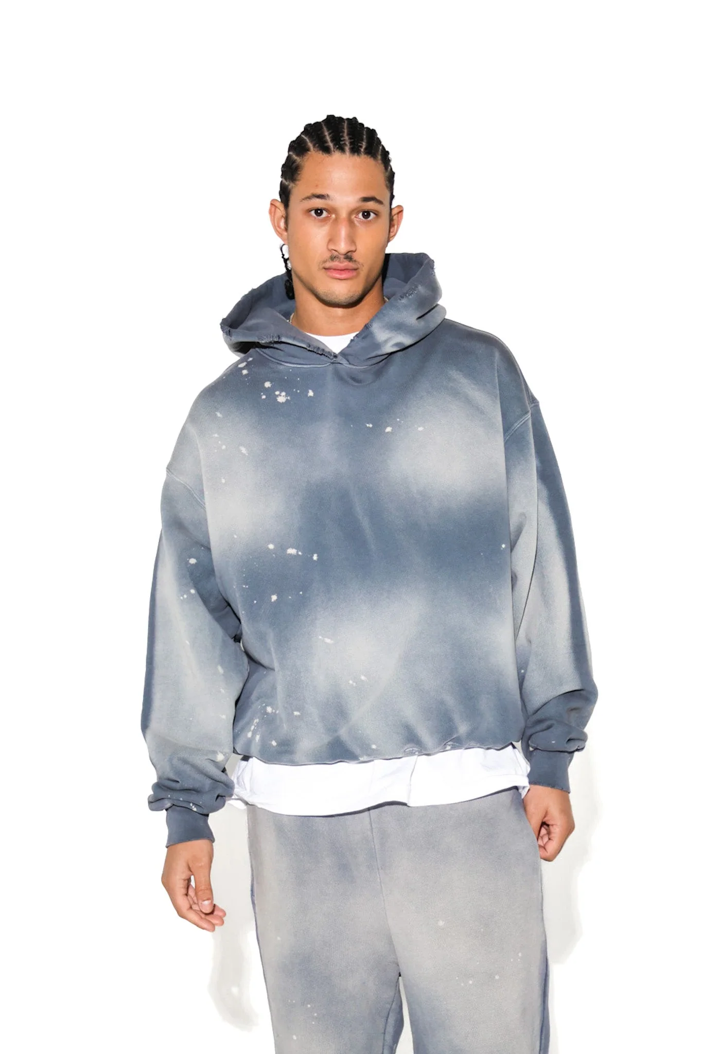 Studio portrait of a model in a blue-gray washed Cannon Mitchel hoodie.