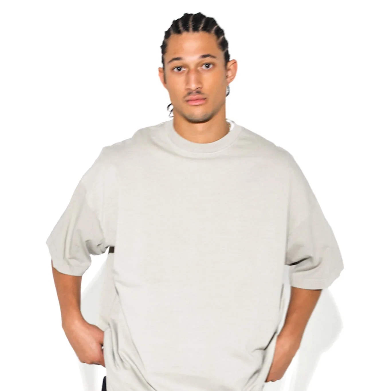 Close studio crop of a model in a light neutral Cannon Mitchel tee.