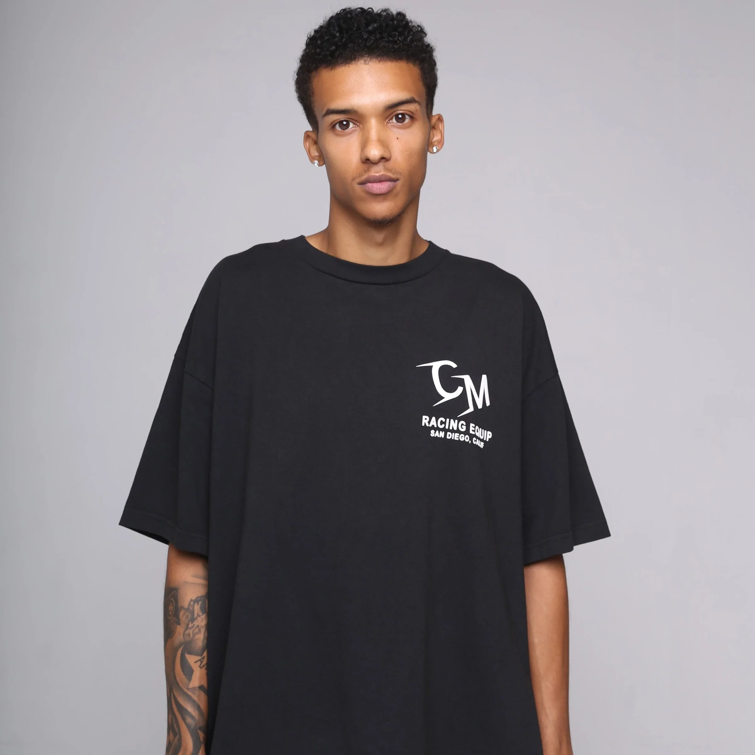 Close studio portrait of a model in a black Cannon Mitchel graphic tee.