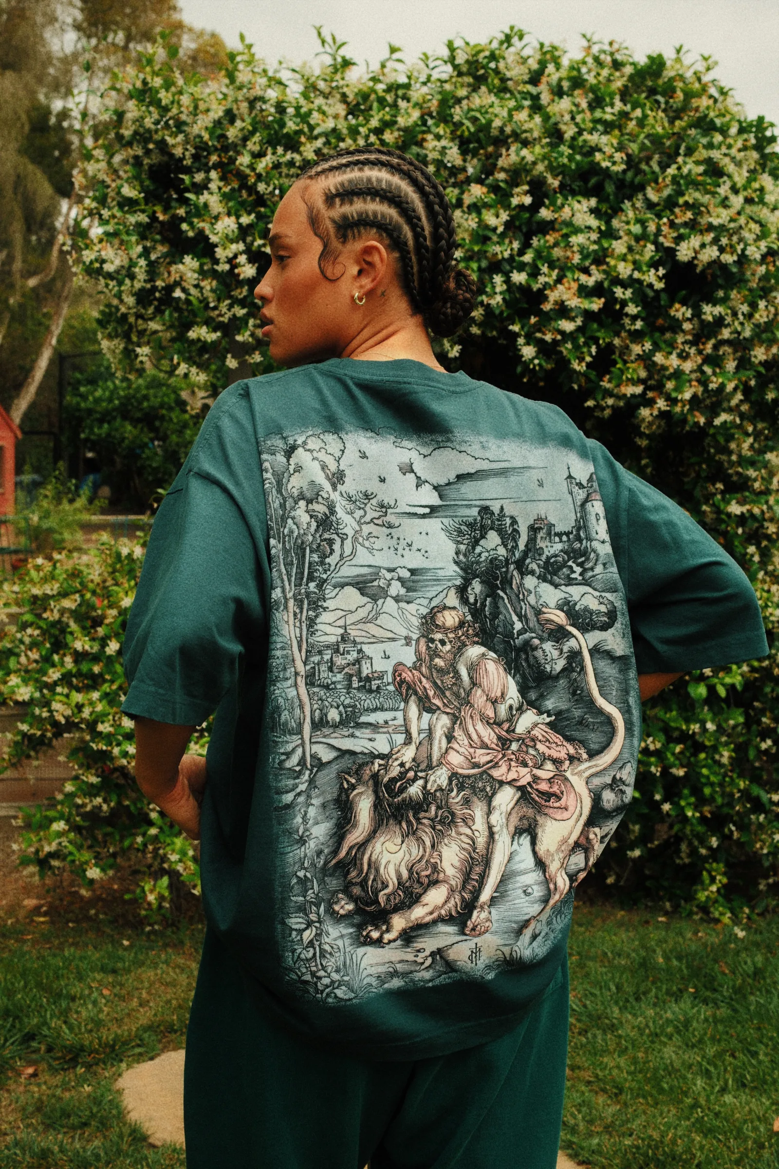 Close back view of the eucalyptus Cannon Mitchel graphic tee.