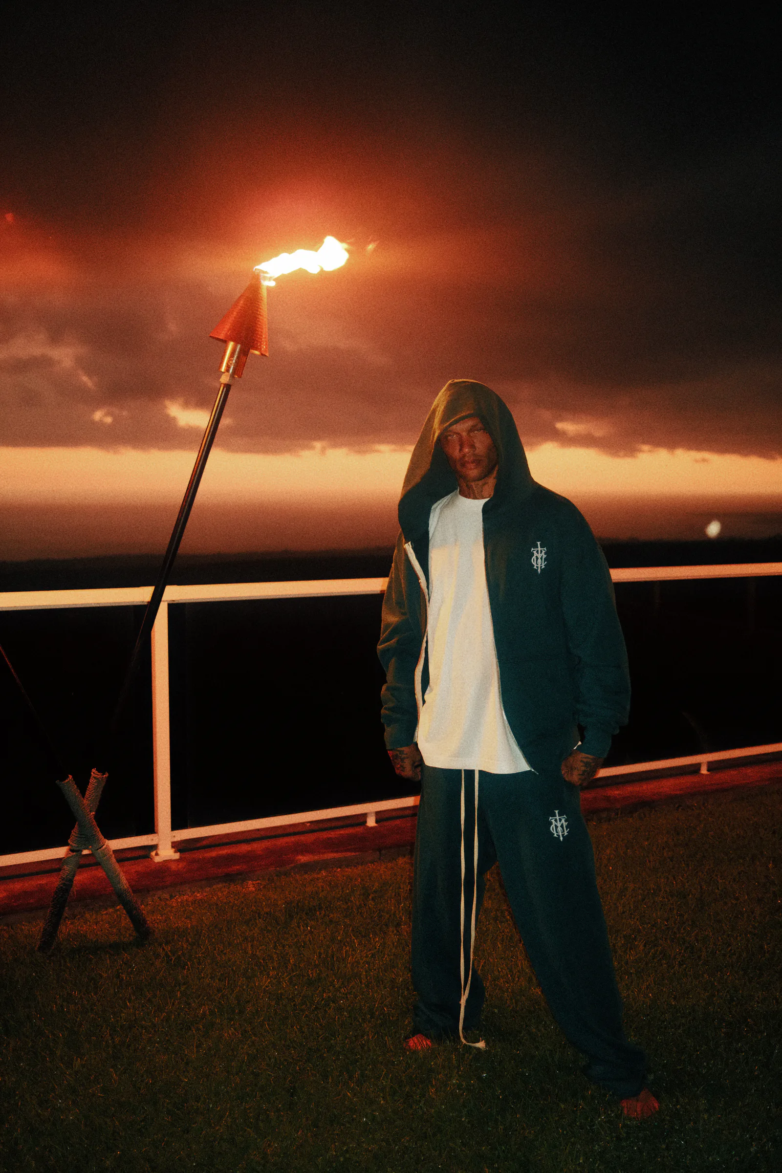 Eucalyptus Cannon Mitchel full-zip set beneath torchlight.