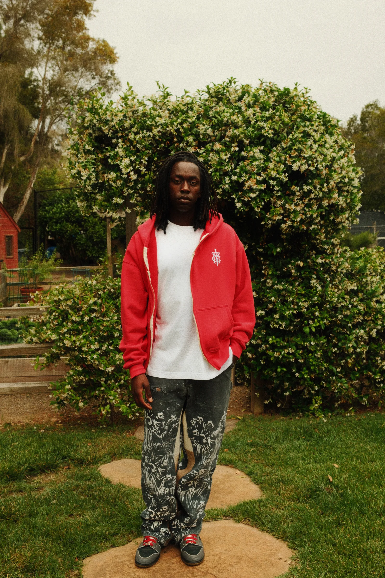 Red Cannon Mitchel full-zip hoodie styled in the garden.