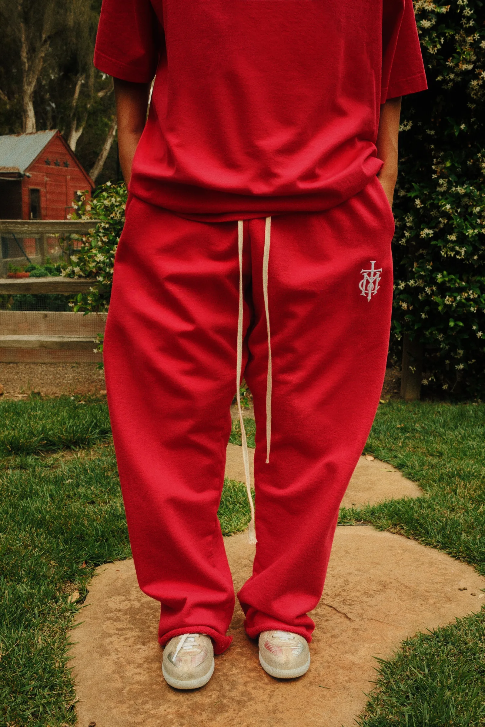 Close view of red Cannon Mitchel pants and extended drawcord.