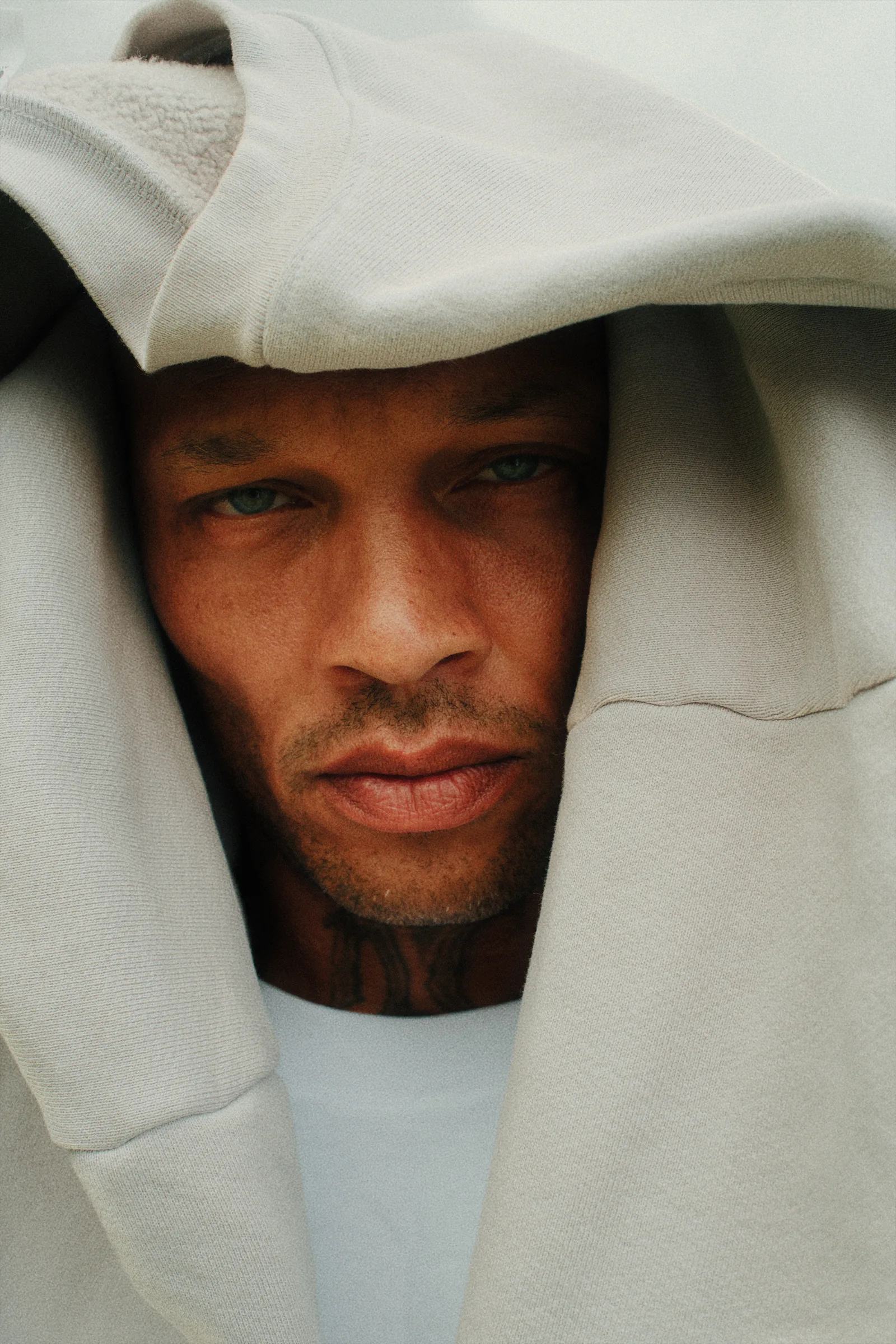 Close Cannon Mitchel portrait framed by a sterling hood.