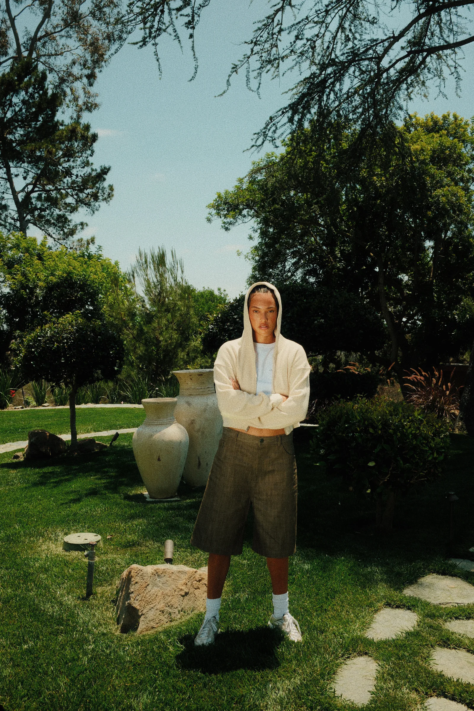 White Cannon Mitchel hoodie and shorts styled in the garden.