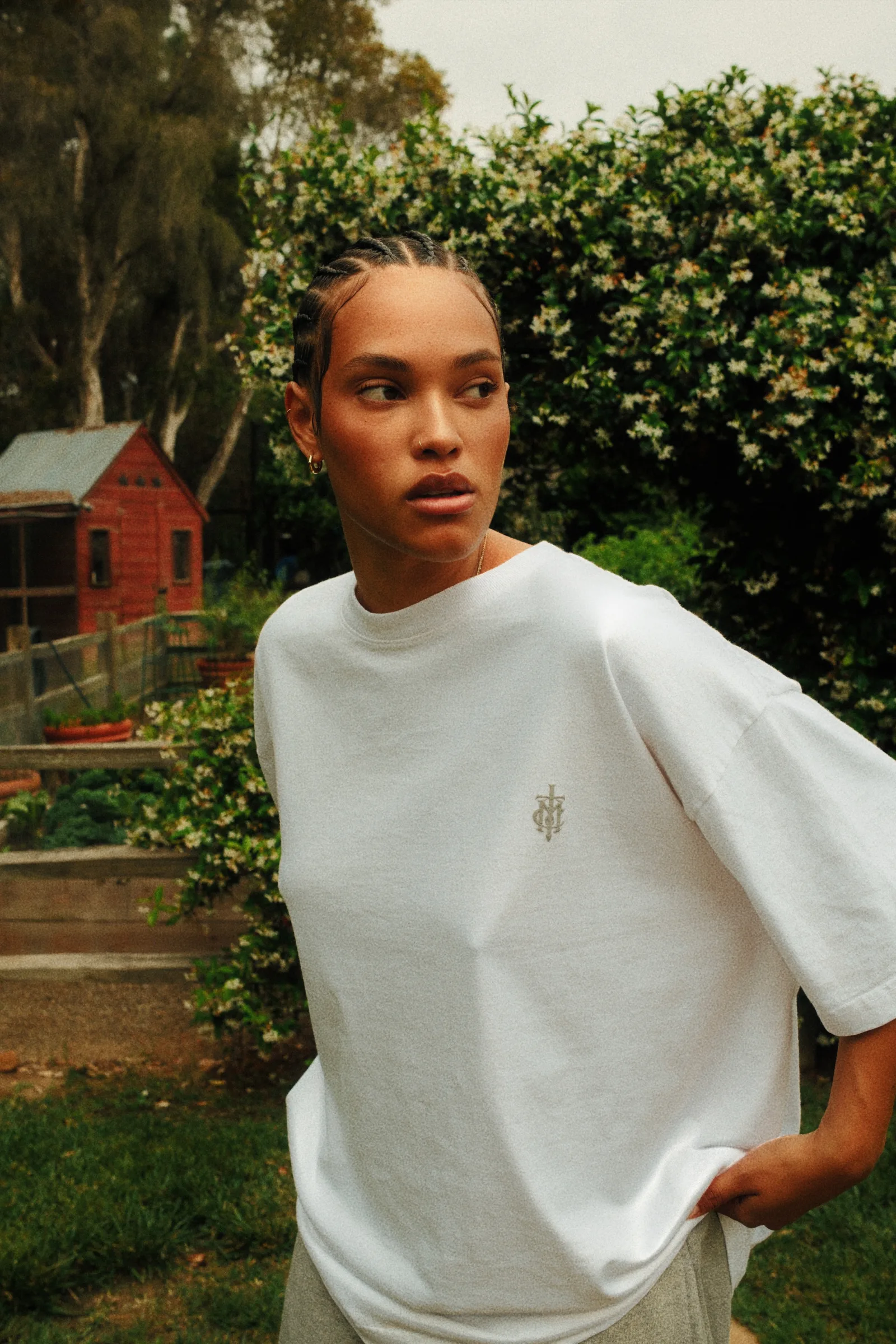 Oversized white Cannon Mitchel tee photographed in the garden.